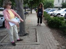 Molly MacRae and Evelyn Shapiro discuss the width and the pavement quality of the sidewalk along Park Avenue.